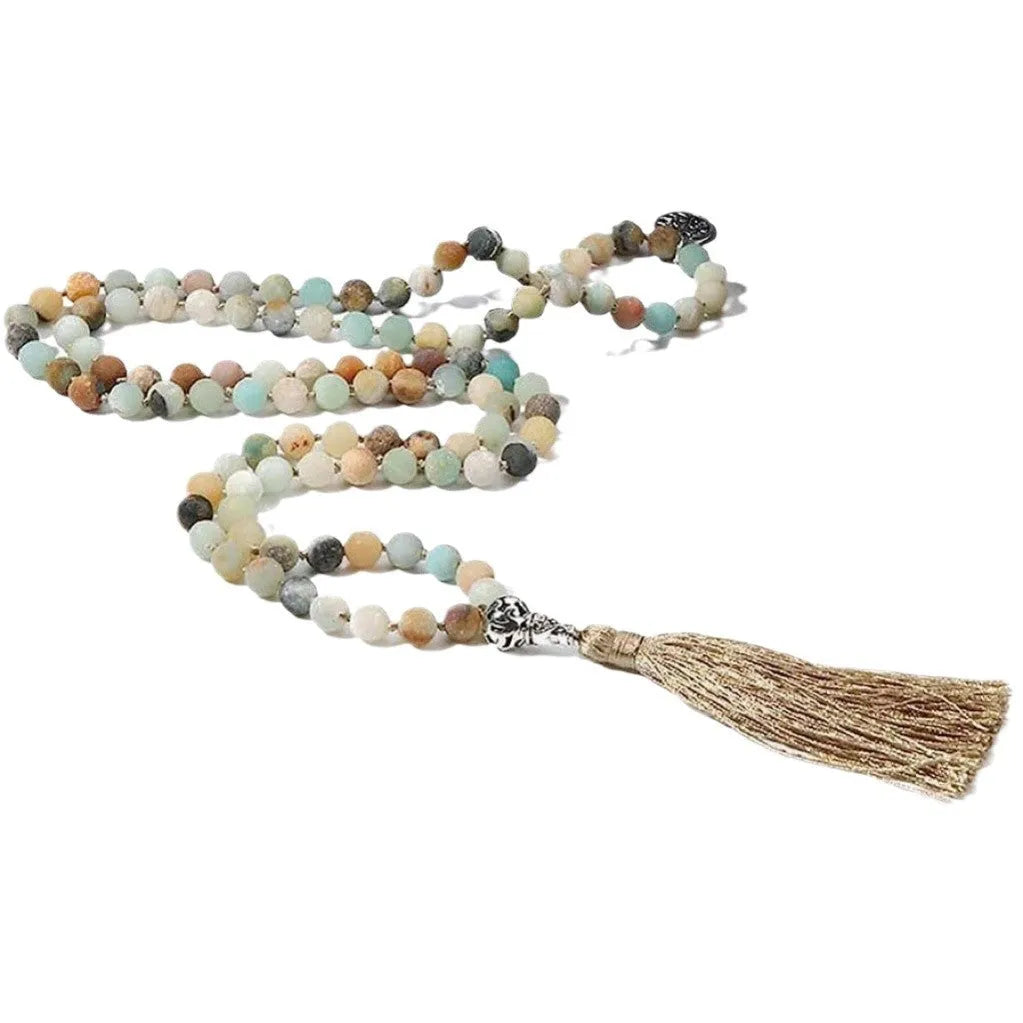 Handmade knotted beaded necklace with stone pendant showing 108 beads and geometric design