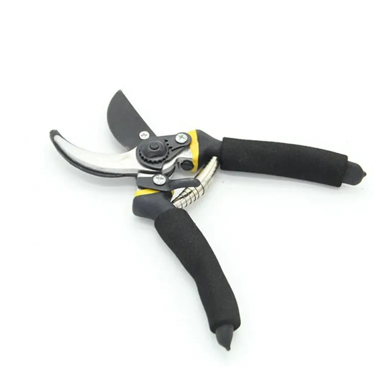 Yellow garden pruning shears with PVC handles and Teflon-coated steel blades for trimming fruit tree branches