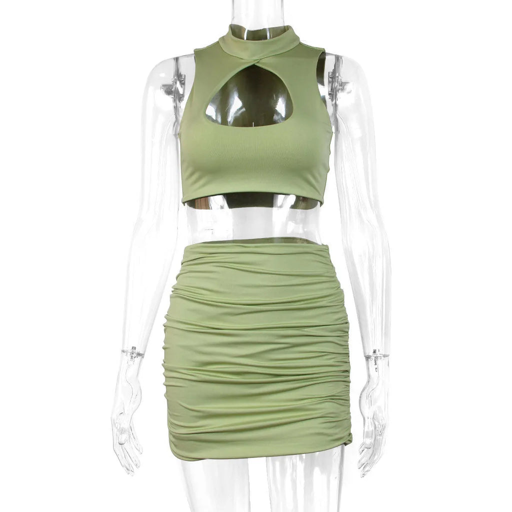 Light purple two-piece set with hollow vest top and split hip skirt on a model.