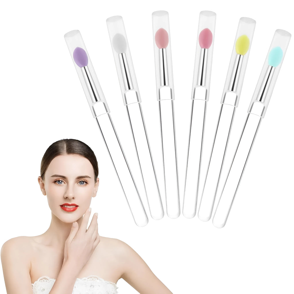 Set of eight colourful reusable silicone lip brushes with hygienic protective caps laid out.