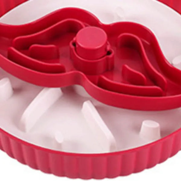 Grey plastic pet bowl with rotating windmill-pattern slow feeder licking mat inside