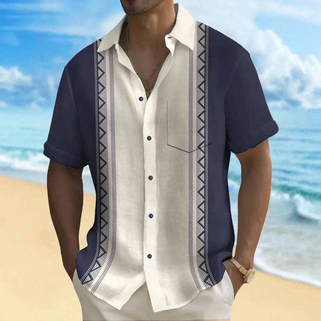Man wearing a loose-fitting, multicolour printed cardigan-style polyester shirt.