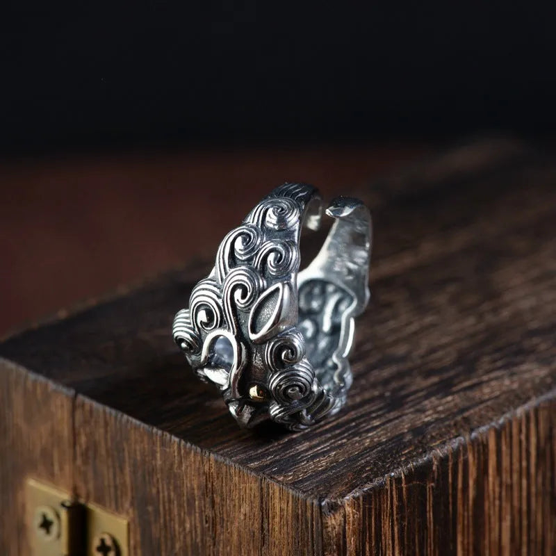 Silver open ring with detailed jibeast animal zodiac pattern and diamond details