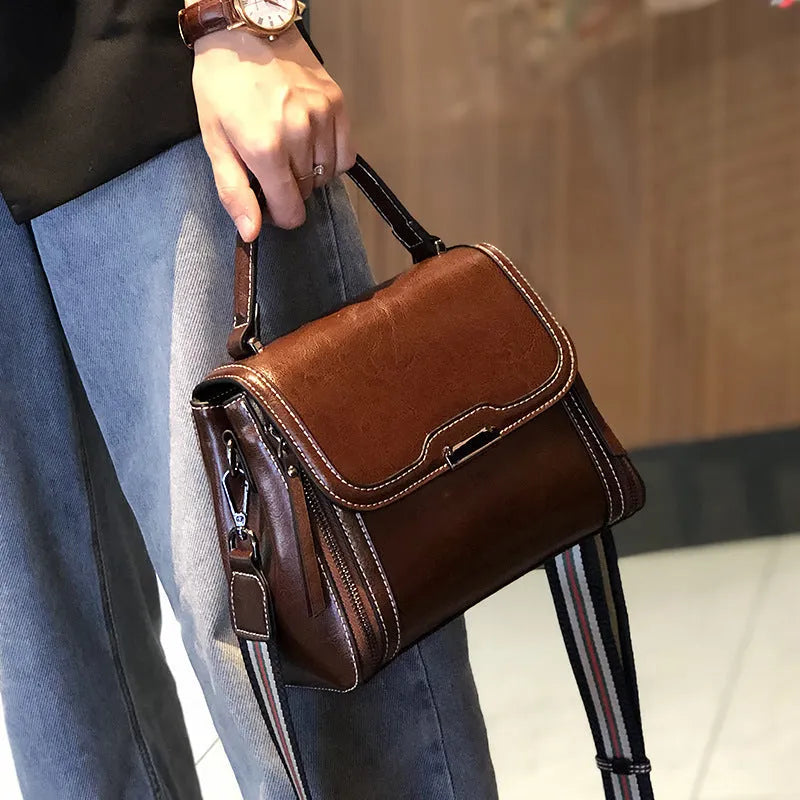 Genuine leather women's messenger bag in horizontal square shape with multiple pockets and double shoulder straps