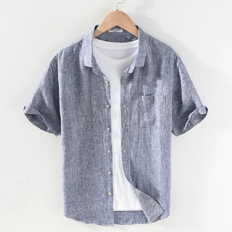 Men's raw jute coloured linen short sleeve shirt with a square collar laid flat.
