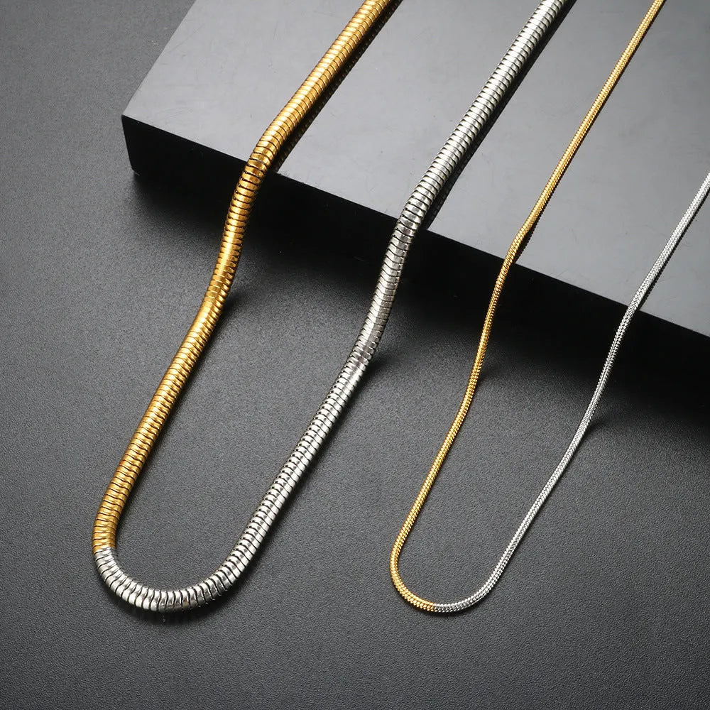 Gold-coloured stainless steel snake chain necklace for women, 3mm wide with geometric links.