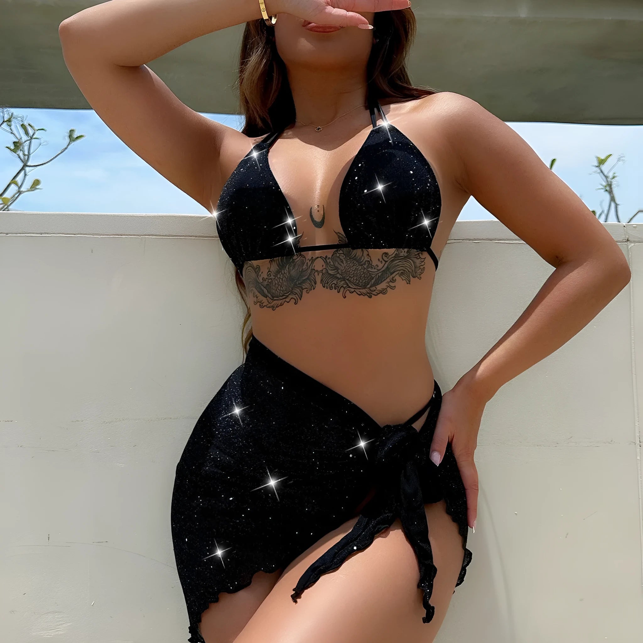 Black three-piece bikini swimsuit set with top and shorts on a mannequin
