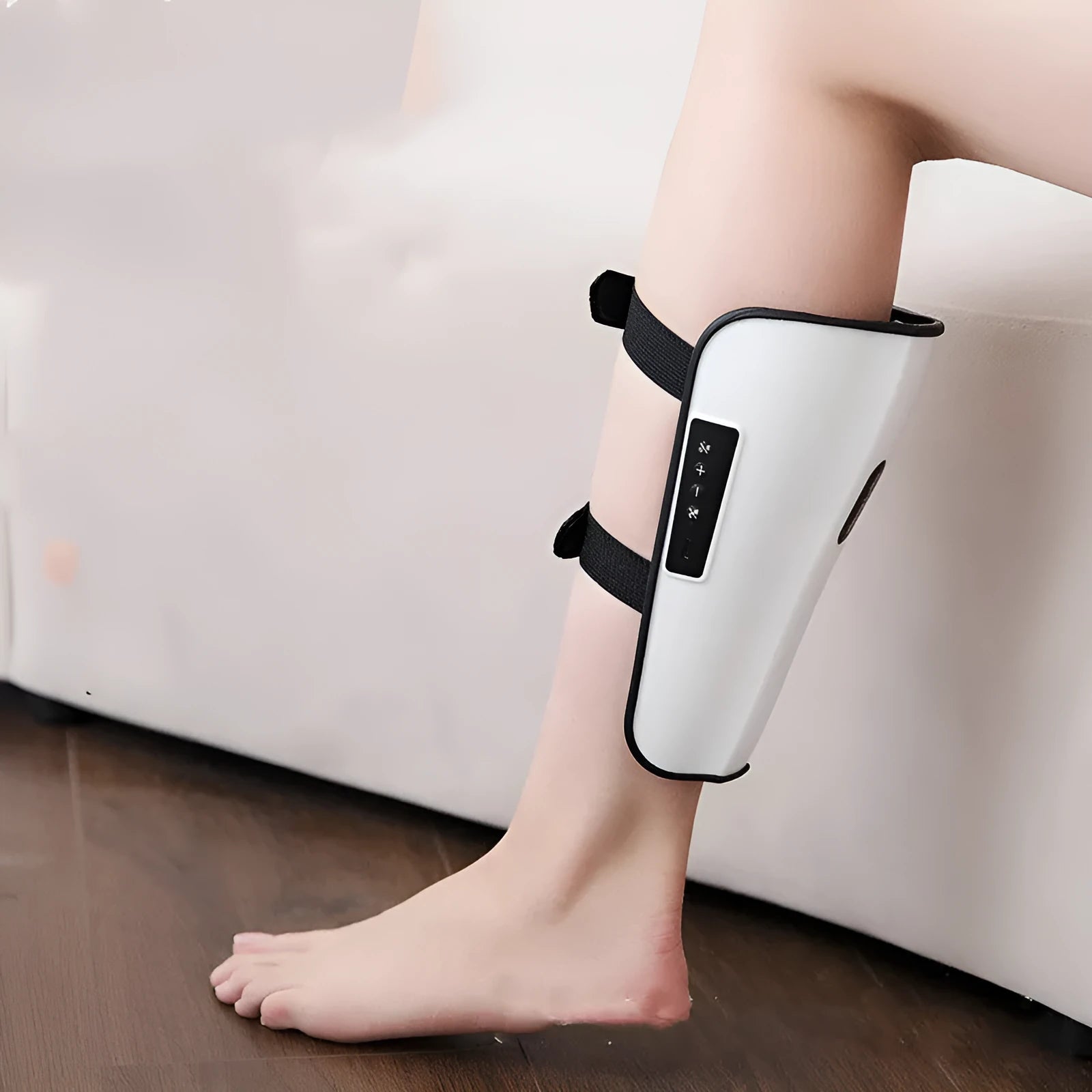 White plastic pulse calf massager with electrotherapy and infrared functions