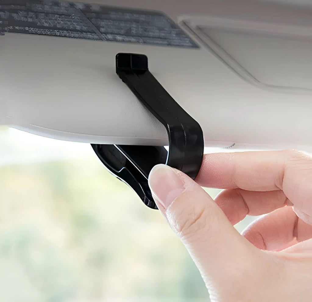 Black plastic clip holder for car sunshade to hold glasses, ID cards, and tickets.