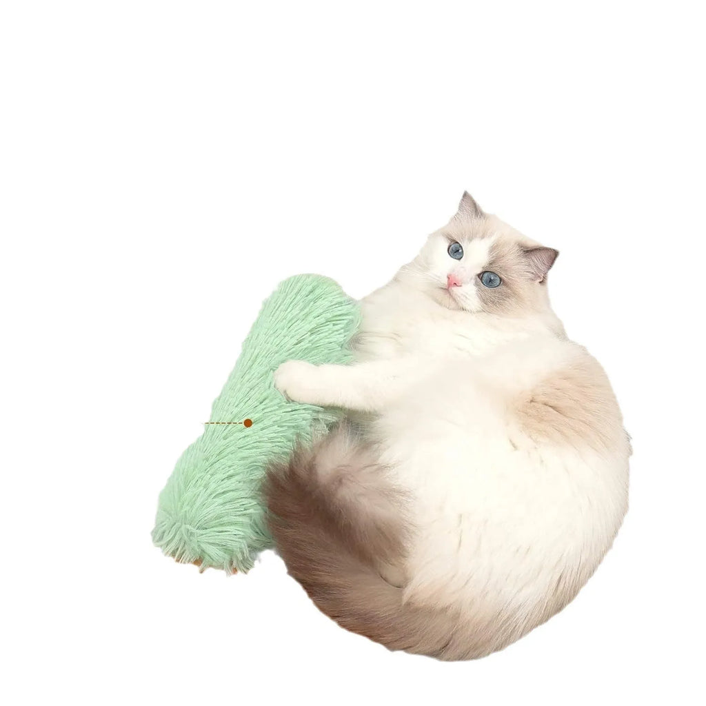 Soft plush cat toy pillow in blue, green, pink, or white, measuring 27 by 10 centimetres.
