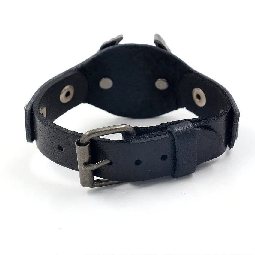 Black geometric leather bracelet with an eagle watch-button, showing tapered width.