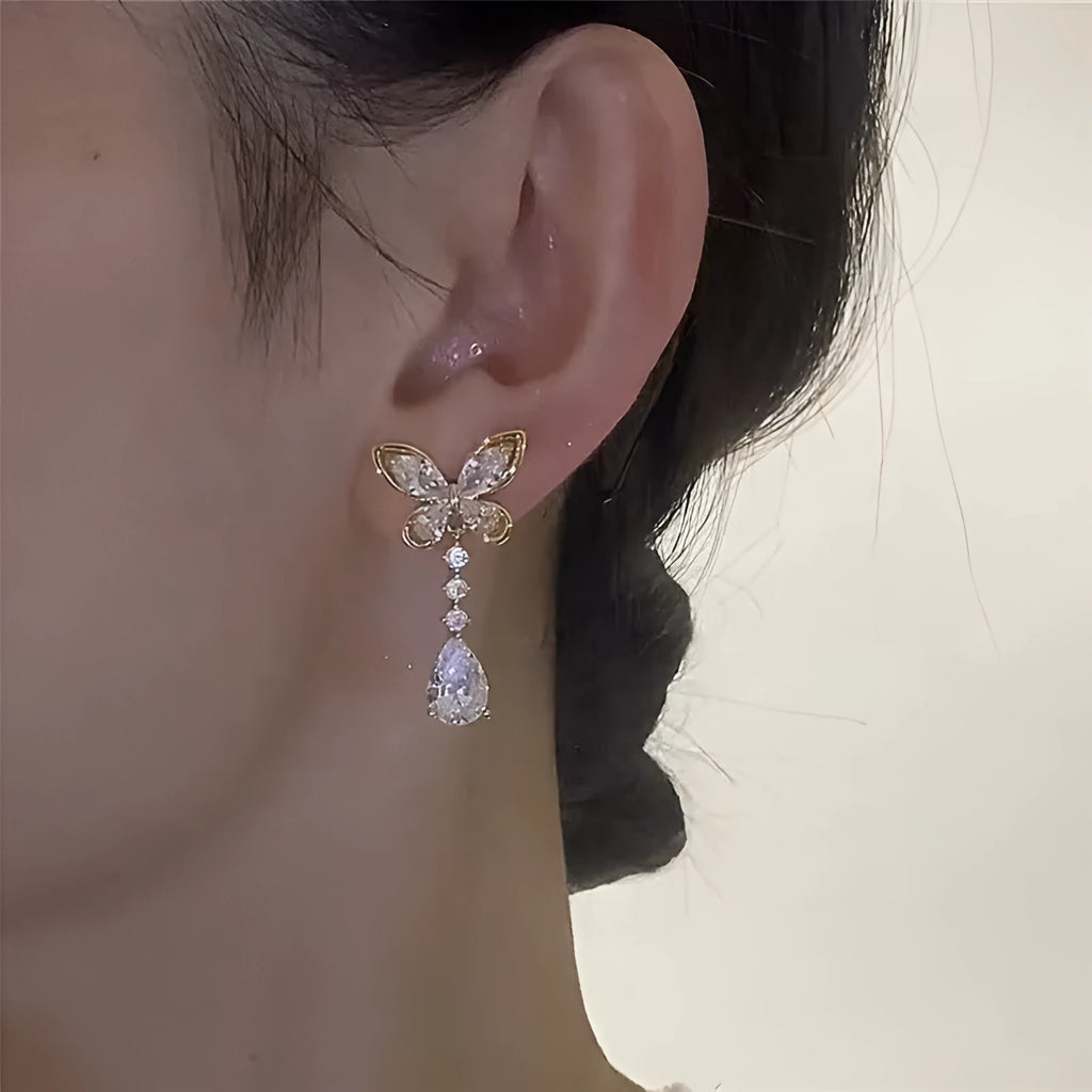 Platinum bow-shaped stud earrings with electroplated finish