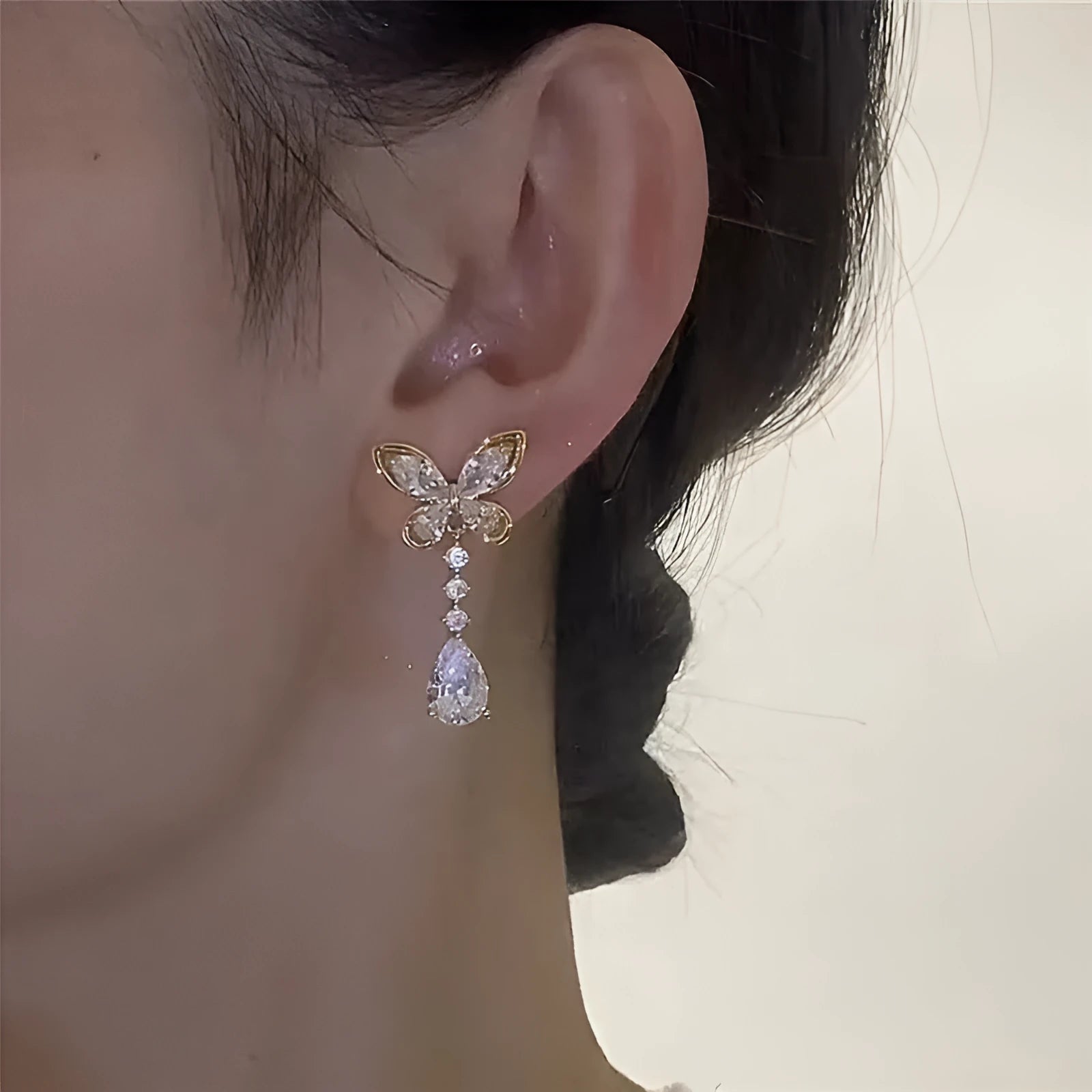 Platinum bow-shaped stud earrings with electroplated finish