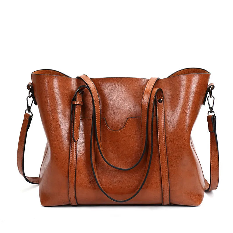 Retro messenger bag for women in multiple colours showing large main compartment and shoulder strap