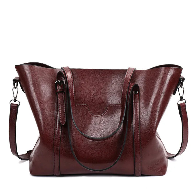Retro messenger bag for women in multiple colours showing large main compartment and shoulder strap