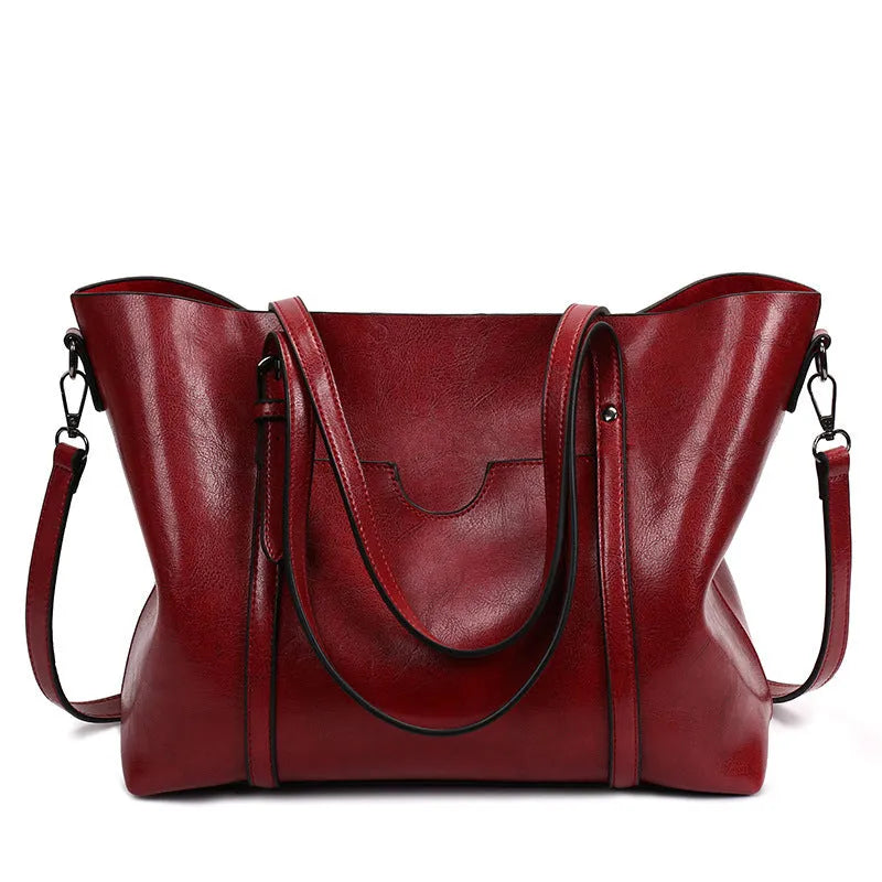 Retro messenger bag for women in multiple colours showing large main compartment and shoulder strap