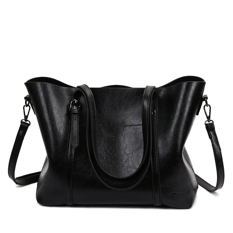 Retro messenger bag for women in multiple colours showing large main compartment and shoulder strap