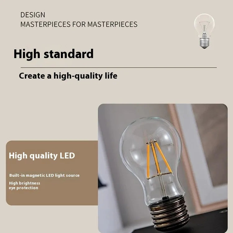Suspended bulb night lamp on black wood grain base measuring 11cm for desktop decoration