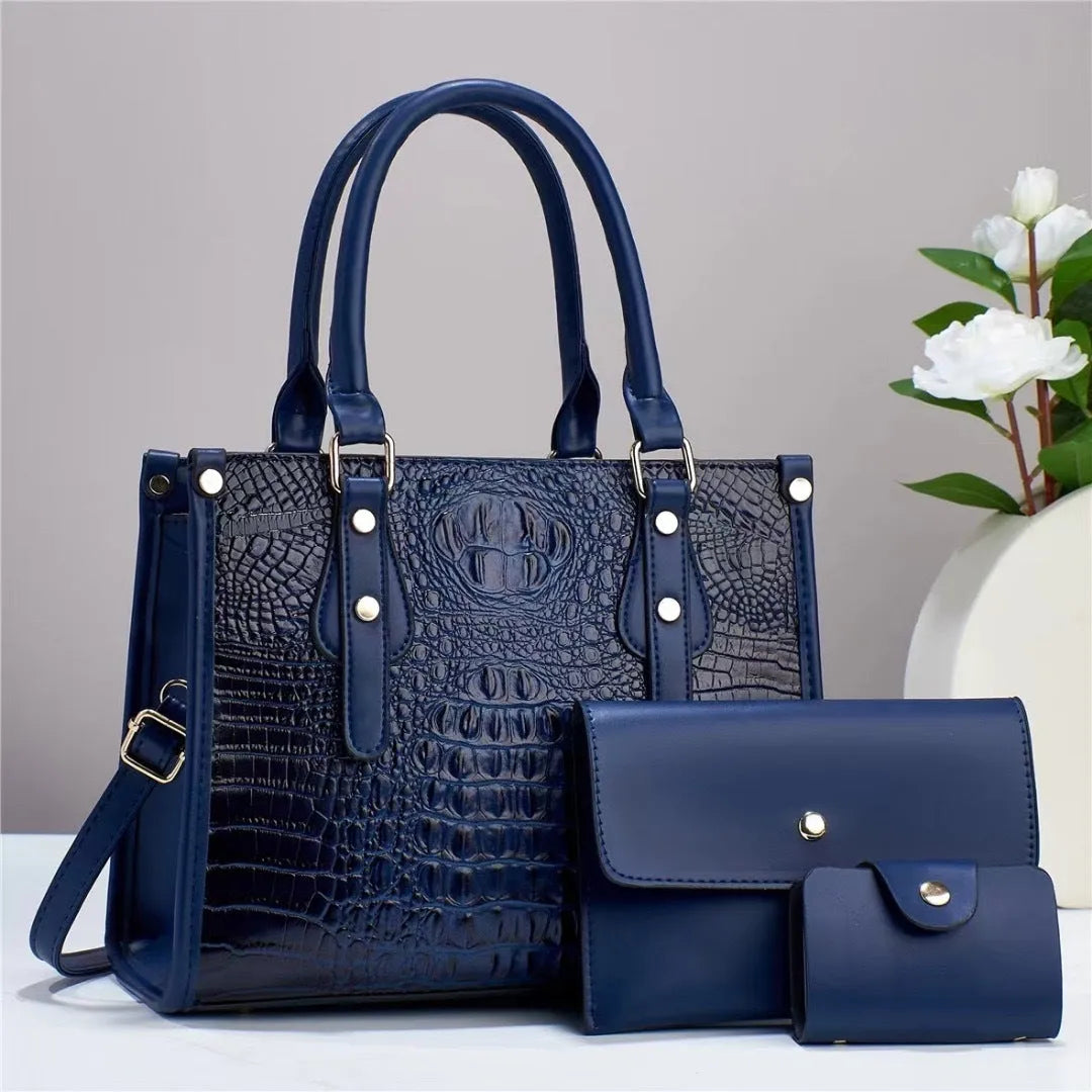 Minimalist textured PU three-piece bag set showing crossbody bag, wallet, and card holder in a contrast colour.