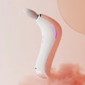 Mini electric massage gun with hot compress, LCD screen, and three massage heads in pink