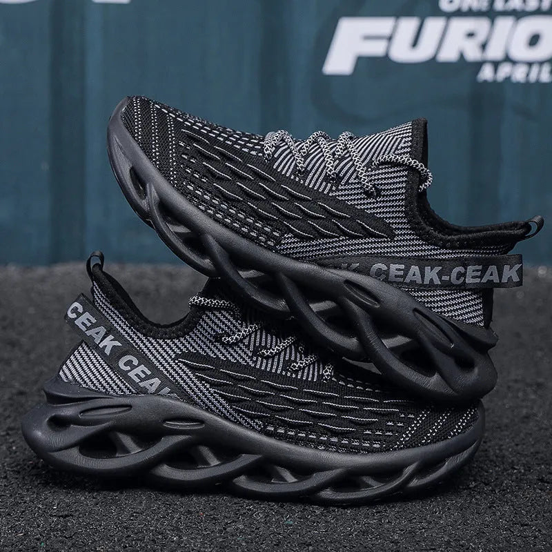 Blade mesh sports shoes in black with low-top design, lace-up closure, and breathable upper