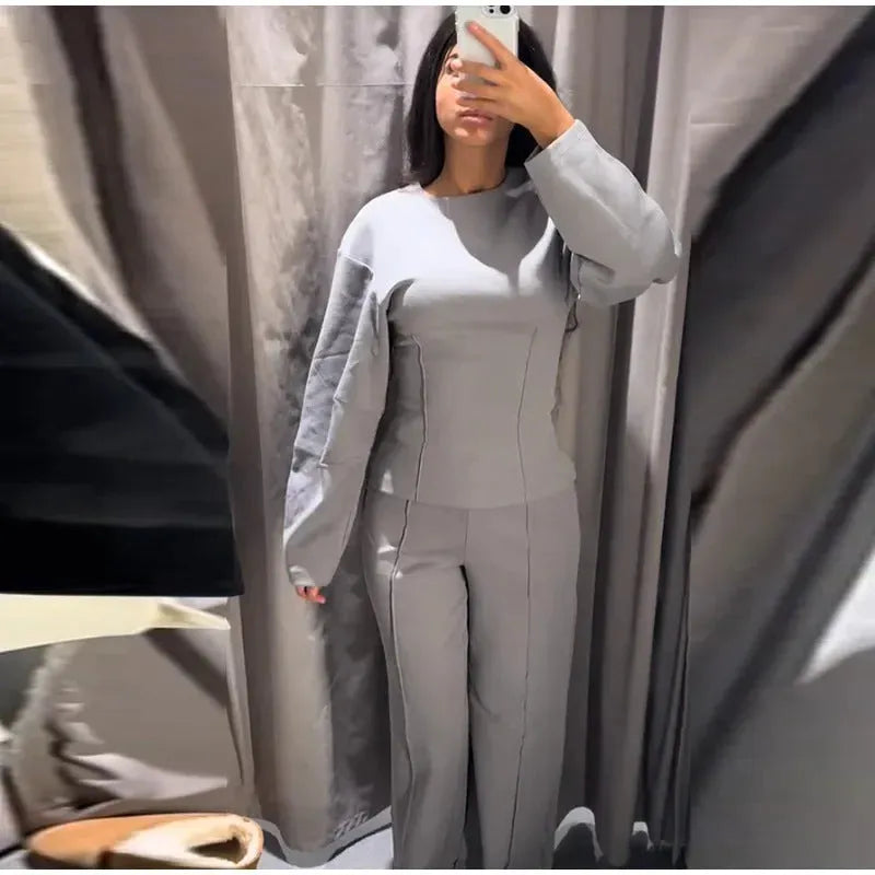 Women's polar fleece two-piece suit set showing long sleeve O-neck top with wide-leg trousers