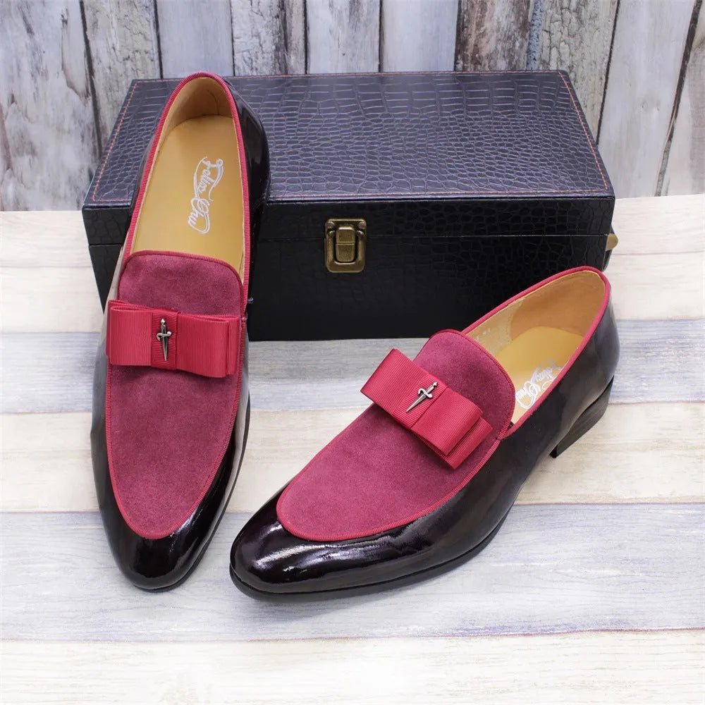 Men's black patent leather low-top dress shoes with a tassel detail on the front.