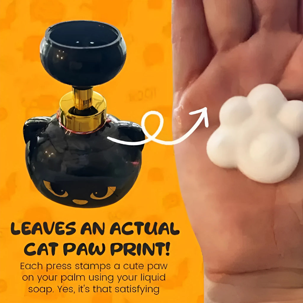 Black plastic cartoon cat-shaped foam soap extrusion dispenser on a bathroom countertop.
