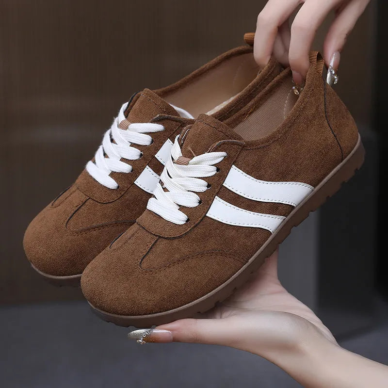 Women's vintage canvas sneakers in dark red and khaki with a round toe and flat rubber sole.