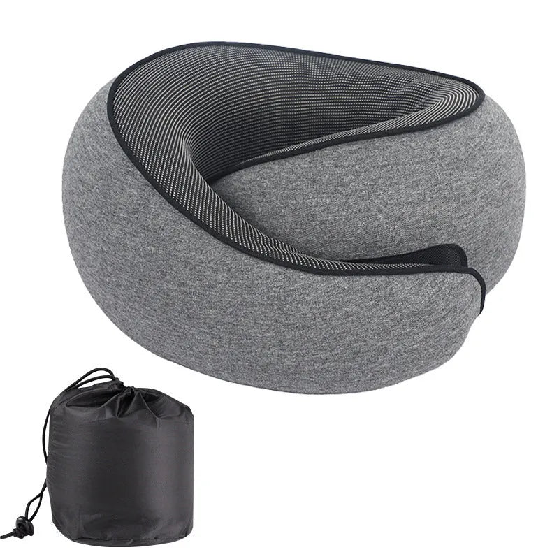 Grey U-shaped memory foam travel neck pillow with a storage bag.