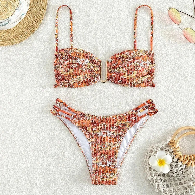 Women's floral print bikini swimsuit with high-waisted briefs in orange, blue, and rose red colours