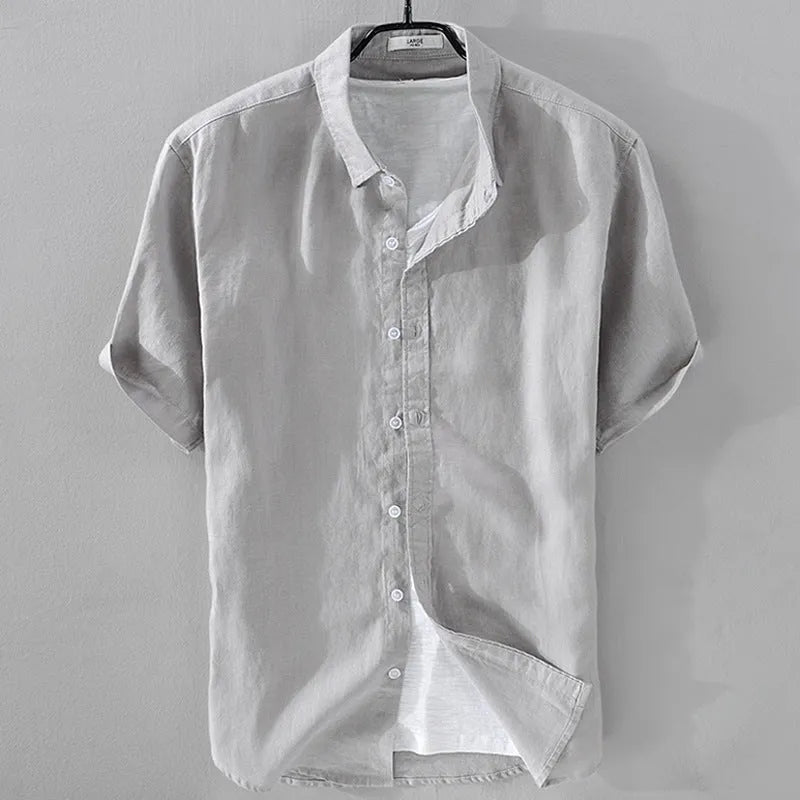 Men's loose fit short sleeve linen shirt in a cotton and linen blend, shown in apricot colour.