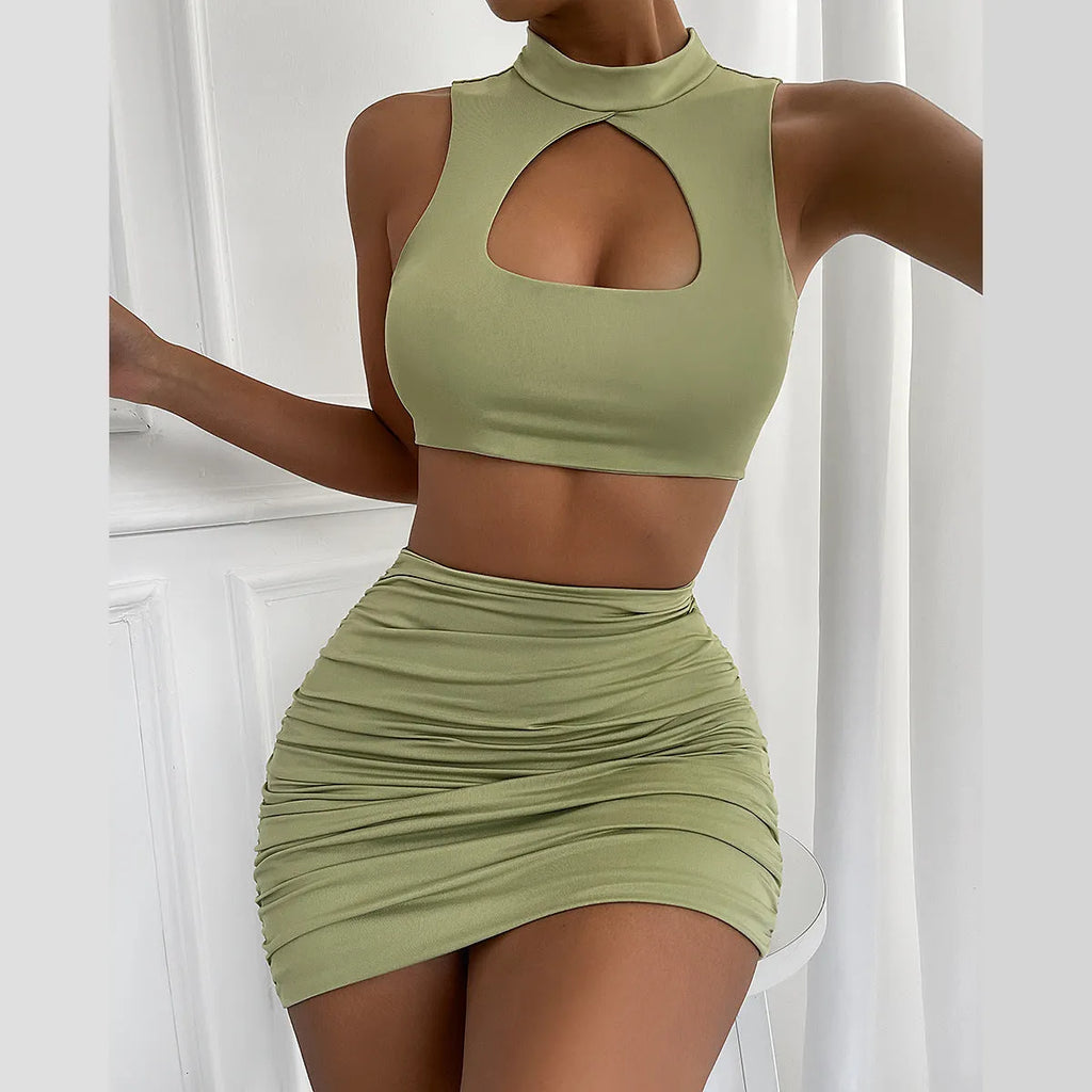 Light purple two-piece set with hollow vest top and split hip skirt on a model.