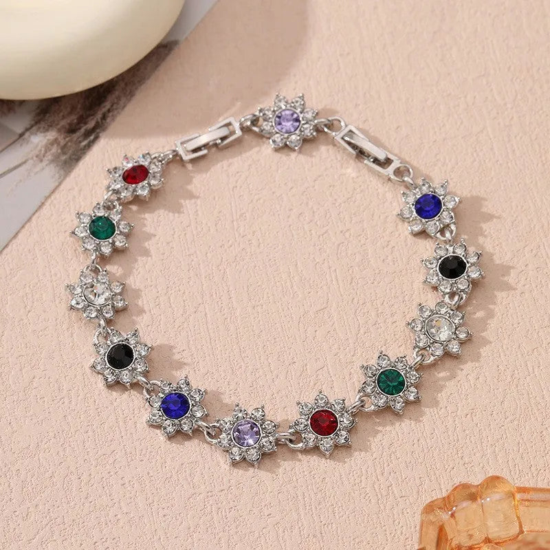 Zinc alloy flower bracelet with electroplated colour finish and colourful crystal decorations in gold and silver variations