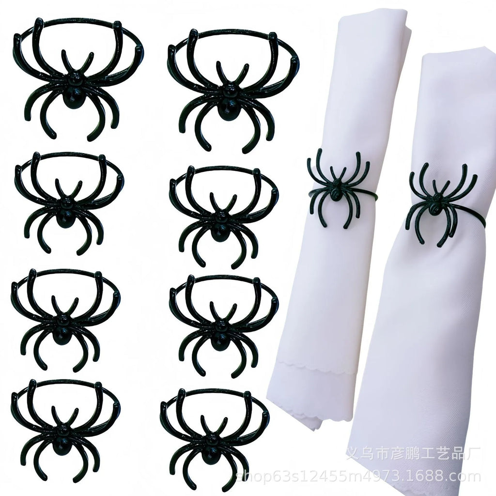 Six black metal spider napkin rings for Halloween table decoration