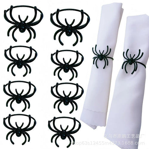 Six black metal spider napkin rings for Halloween table decoration