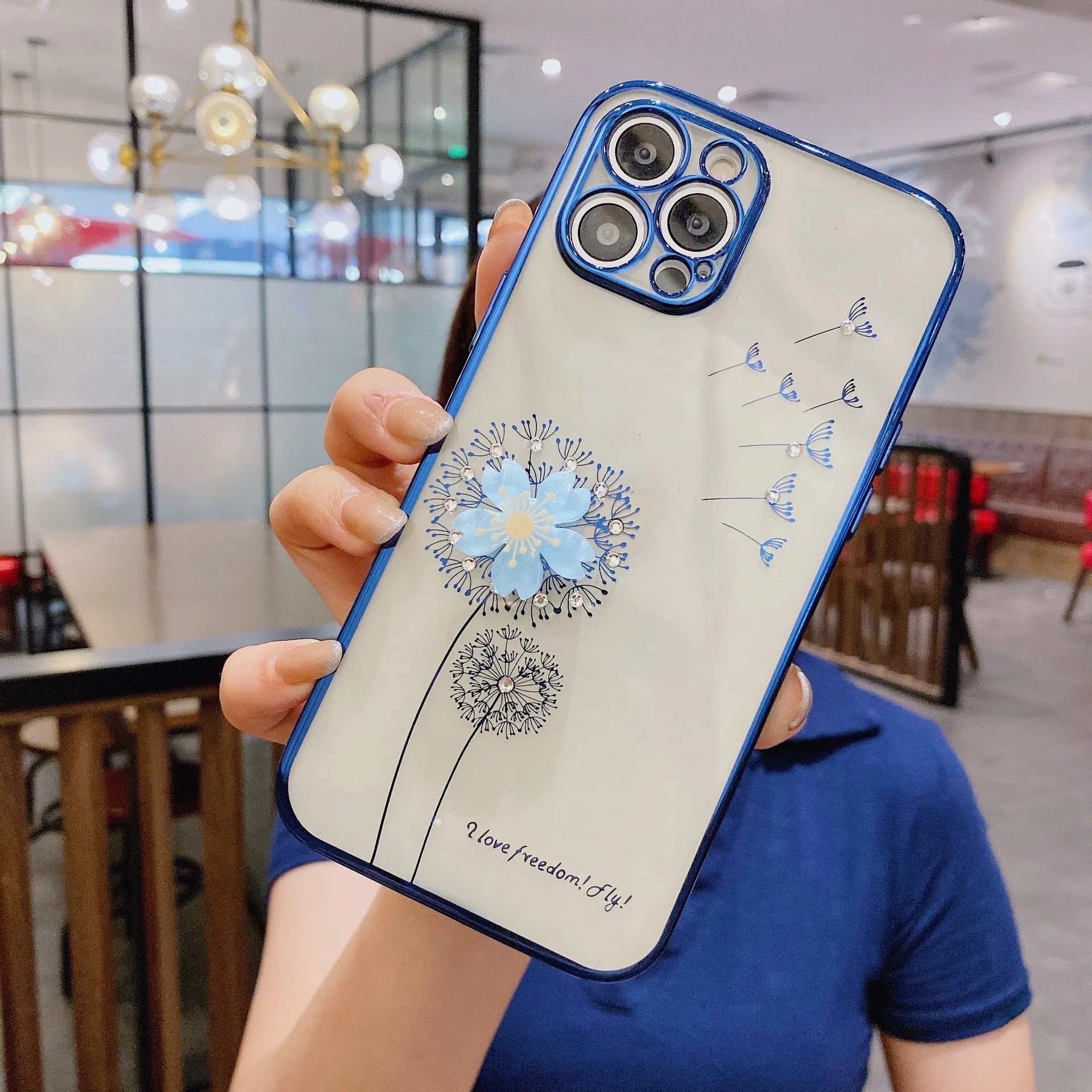 Green silicone iPhone case with a 3D floral design and a built-in spin stand on a white background.