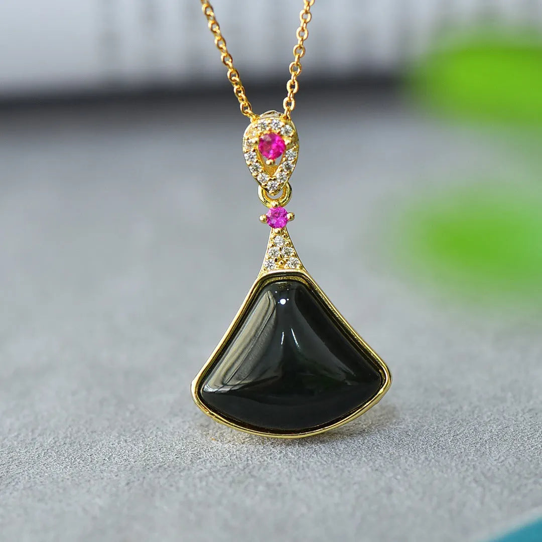 Flat geometric Hetian jade pendant with copper inlay on a necklace chain.