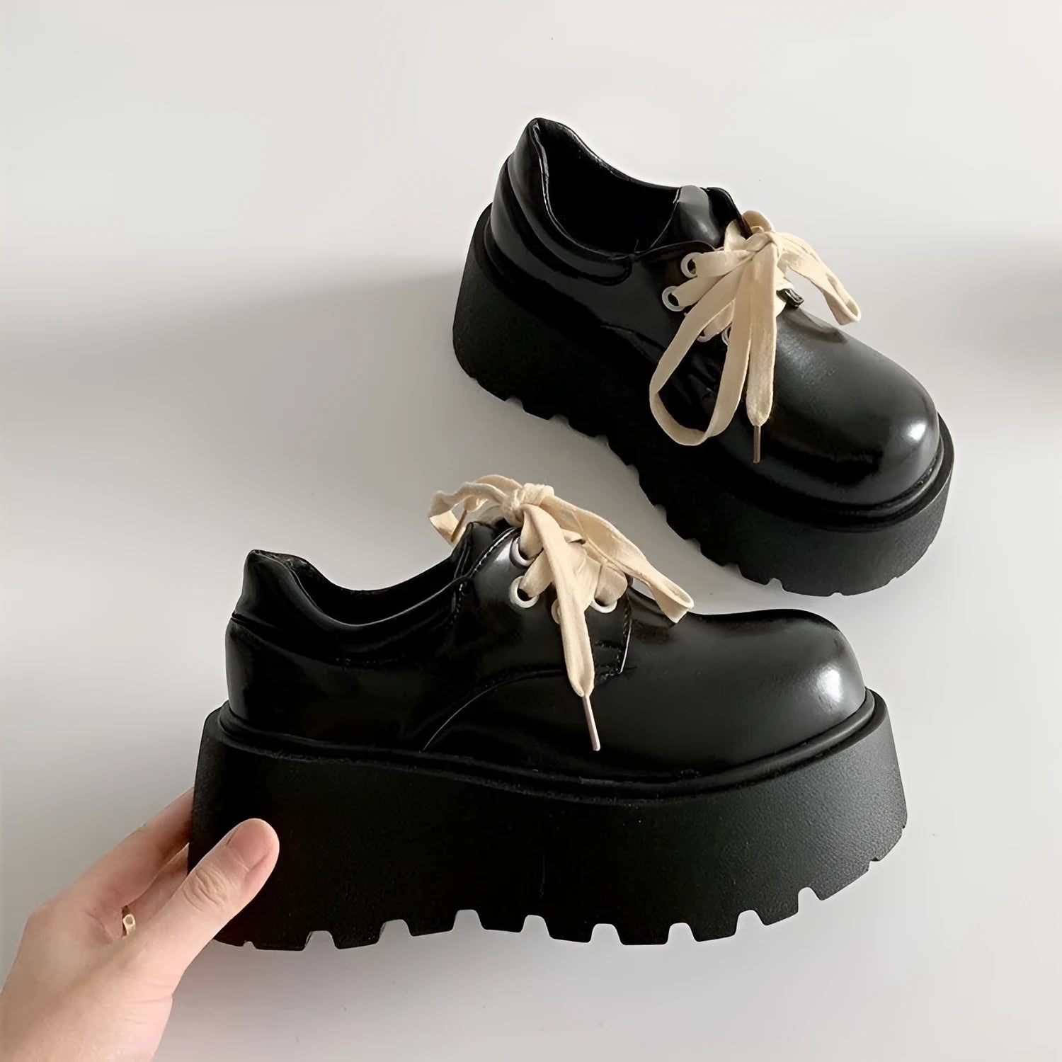 Women's matte black lace-up shoes with a chunky 6-8cm heel and thick rubber sole.