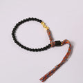 Hand-woven obsidian carrying strap bracelet showing 4mm width and adjustable length