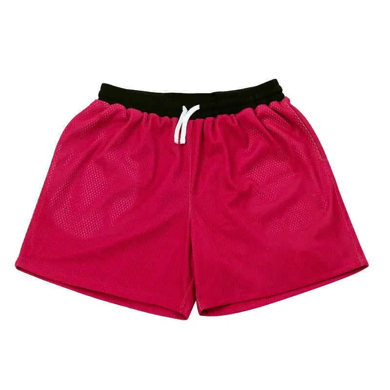 Men's solid colour mesh quick-drying sports shorts for running and fitness.