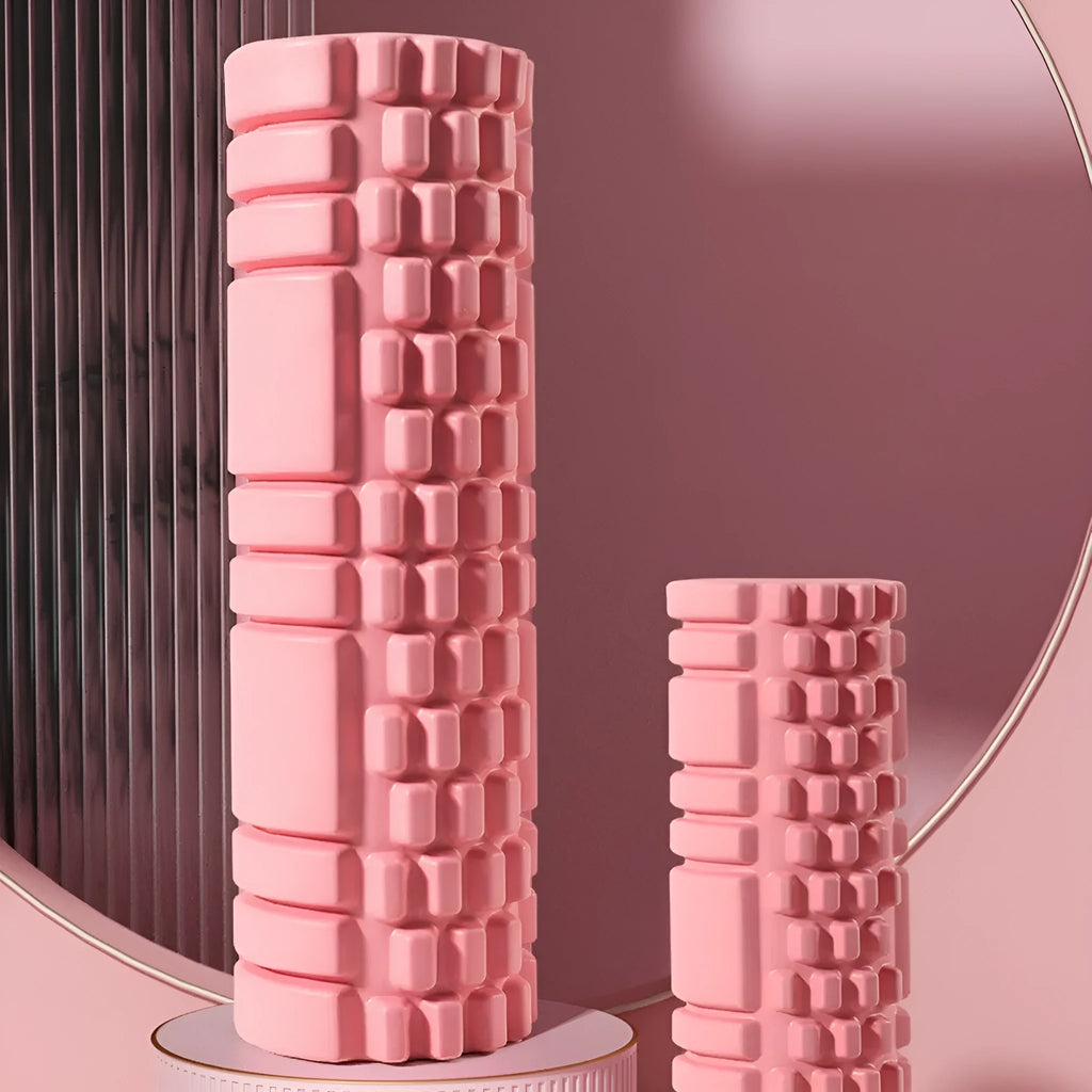 EVA foam roller in various colours including black, grey, pink, blue, and purple on fitness mat