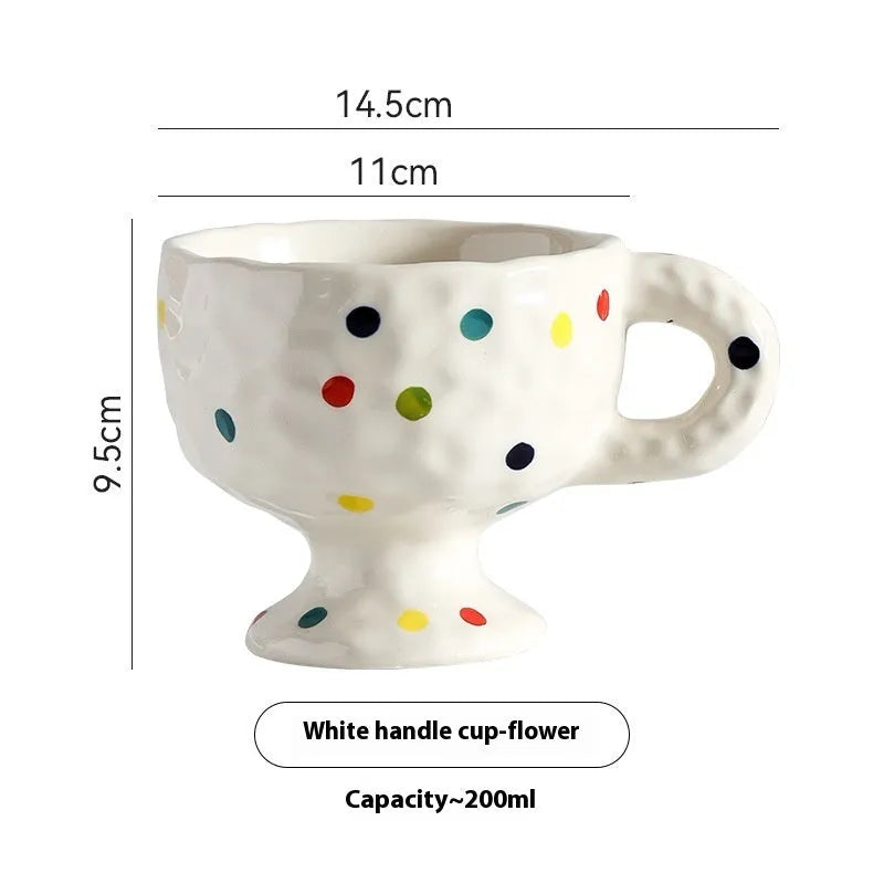 Hand-pinched irregular ceramic mug with modern minimalist design in solid colour