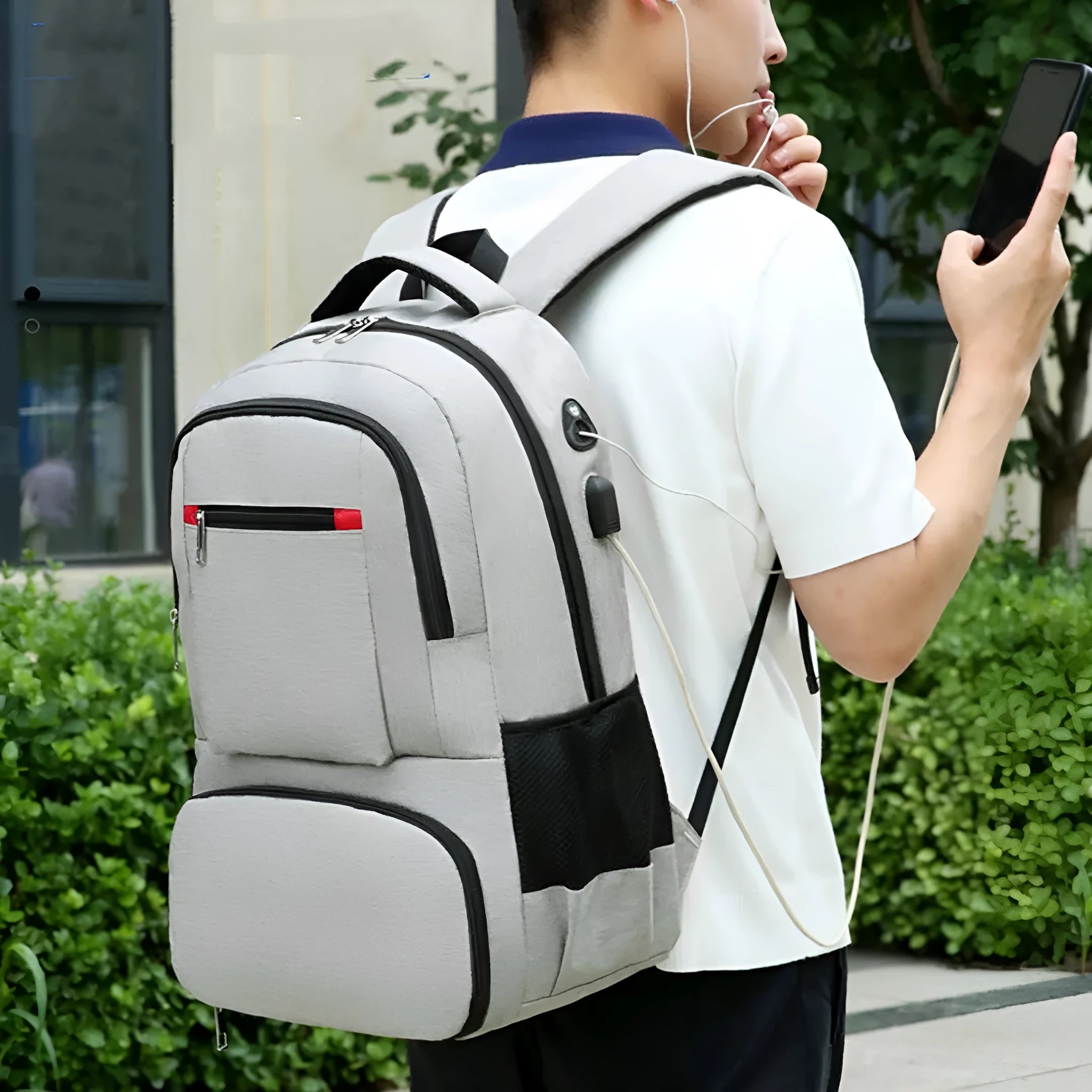 Light grey Oxford cloth insulated backpack with curved shoulder straps and pull rod belt
