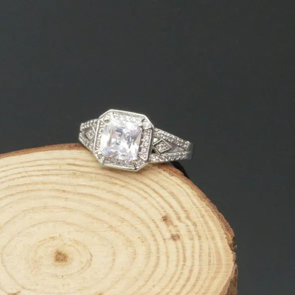 Geometric hollowed zircon ring in platinum colour on copper with quadrilateral design
