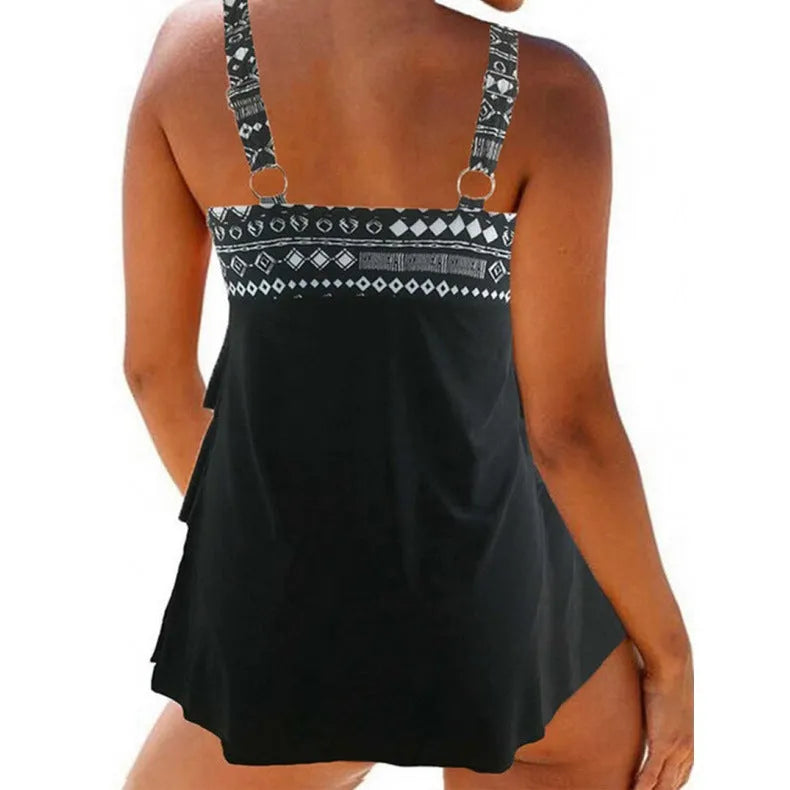 Women's plus size blue split style swimsuit with double shoulder straps and a central bow detail.