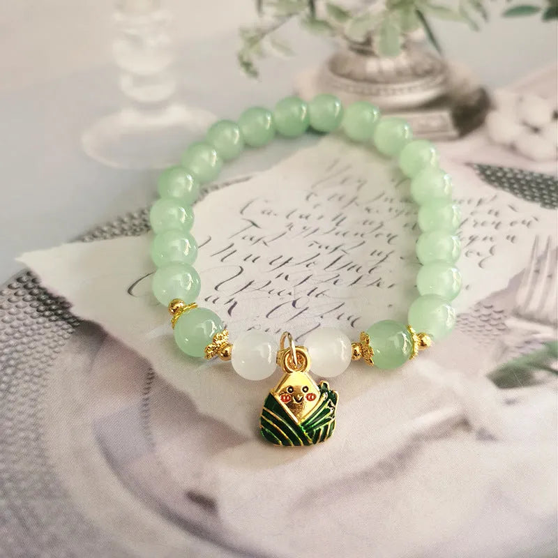 Handmade Chinese style glass bracelet with bamboo joint beads in a red Lvzhu Duobao design.