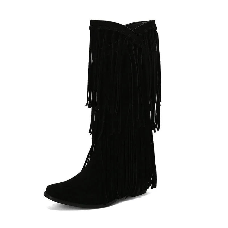 Women's beige suede mid-calf boots with a chunky heel and tassel detail on display.