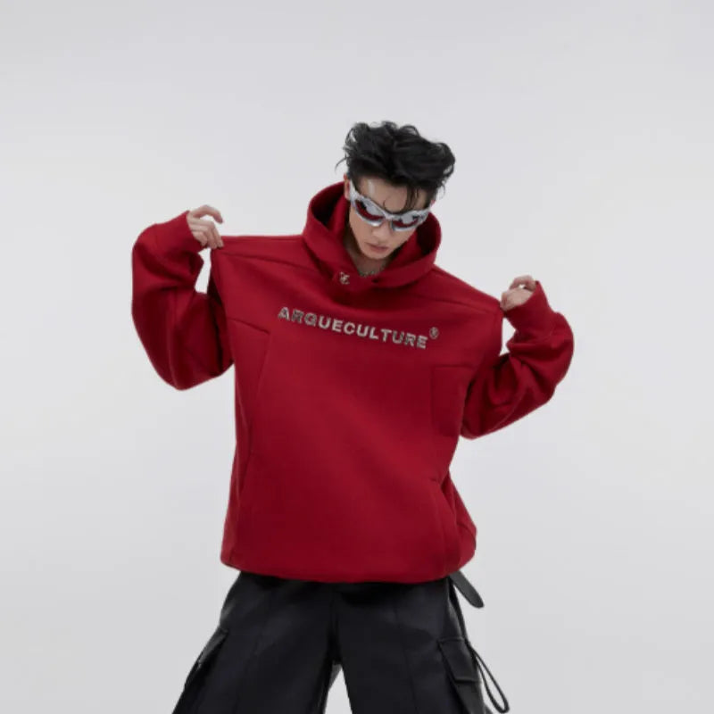 Red men's hooded sweater with heavy shoulder pads and 3D printing detail on a loose fit.