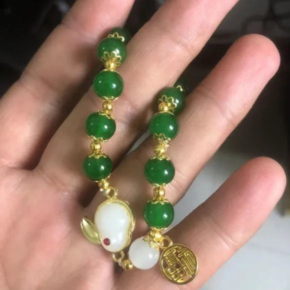 Handmade Chinese style glass bracelet with bamboo joint beads in a red Lvzhu Duobao design.
